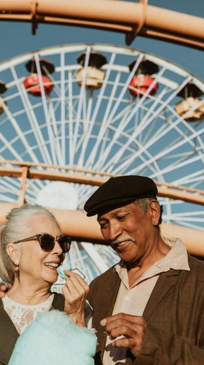 Cheerful,Elderly,Couple,Enjoying,Cotton,Candy,At,Pacific,Park,In Cheerful,Elderly,Couple,Enjoying,Cotton,Candy,At,Pacific,Park,In